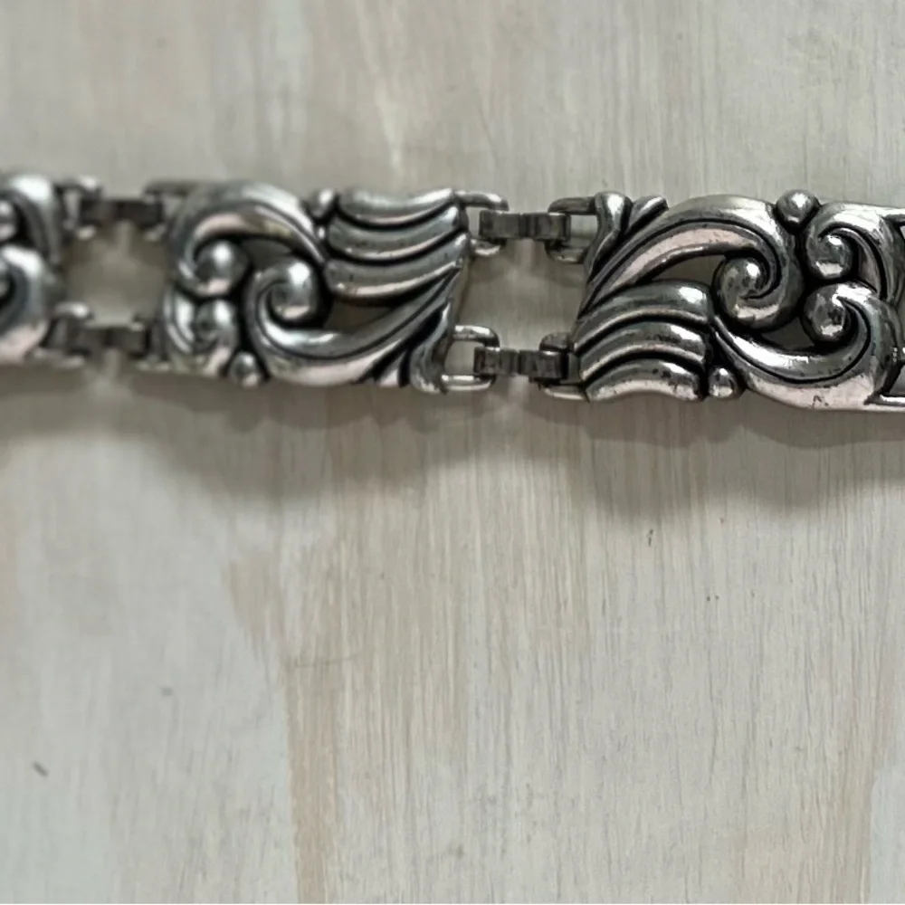 Brighton black leather belt with silver accents. Womens size small.